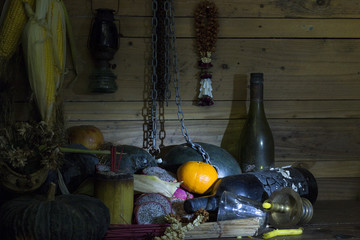 Fresh Oranges,dried of fruits,chain and bottle on wood in room whit dim light to creative for design and decoration isolate on background.Copy space.Concept halloween day.