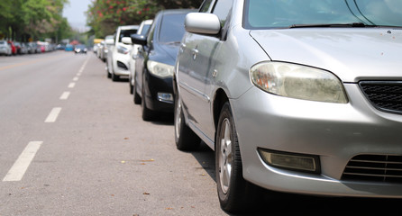 Fototapeta na wymiar Closeup of front side view of car parking beside the street.