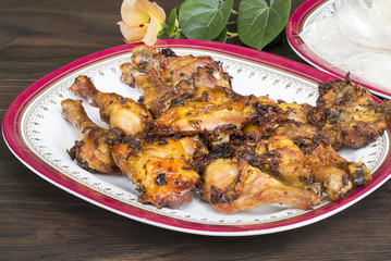 Thai food and traditional menu.Roast chicken and sticky rice with dish on wood.Close up.