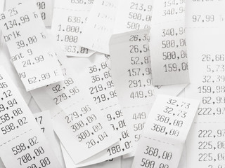 pile of shopping receipts with costs