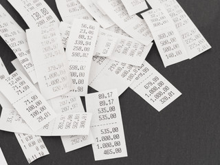 pile of shopping receipts with costs