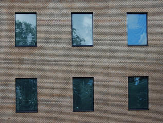 brick wall with six windows