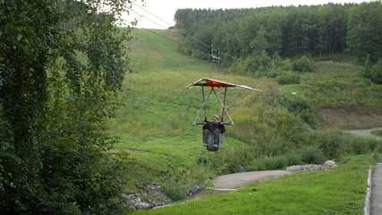 A child riding a hang glider