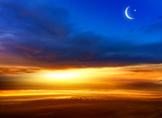 Fototapeta na wymiar Crescent moon with beautiful sunset background . Generous Ramadan . Light from sky . Religion background .