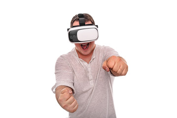 Naklejka premium A man in virtual reality glasses is driving an invisible car playing a game or a simulator.