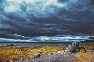 Dramatic landscape with dark sky and sea
