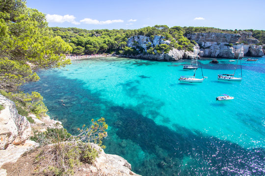 Fototapeta Boats and yachts on Macarella beach, Menorca, Spain