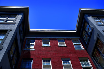 Apartment Building with Red Brick and Blue Sky