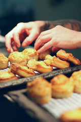 chef plating fresh baked mixed baked pastries