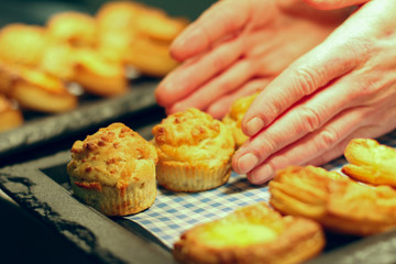 chef plating fresh baked mixed baked pastries