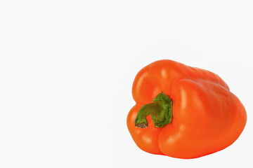 Fresh large orange pepper isolated on white background