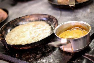 cooking fresh steak in kitchen