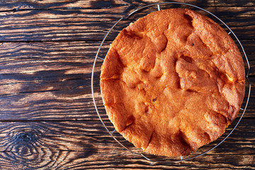 an apple charlotte cake on a wire rack