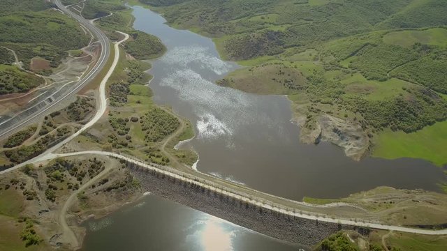 Aerial view of highway road in Techniti Limni Smokovou lake in Greece.