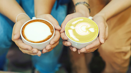 Hand and coffee and hot green tea Young people love to drink hot drinks. Healthy Coffee Food and Drink Concepts