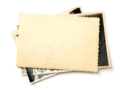 Stack old photos isolated on white background. Mock-up blank paper. Postcard rumpled