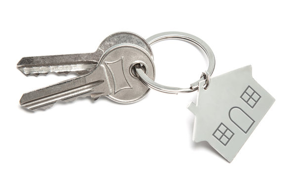 Keys and home key ring isolated on white background. Concept of buying house