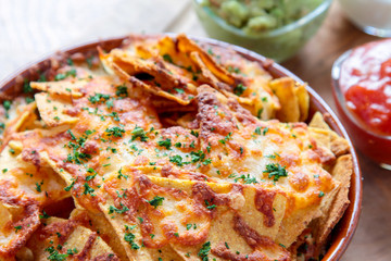 baked nacho chips with dips