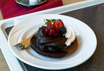 Biscuit with currant, strawberry and blueberry