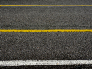 Asphalt surface of road with lines abstract background