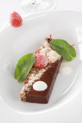 plated raspberry and  chocolate dessert