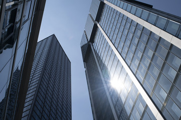 Fototapeta na wymiar Corporate office skyscrapers in the downtown Frankfurt, Germany financial district looking upward.