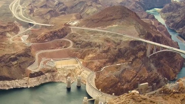 landscape and infrastructure and concept - aerial view of hoover dam and mike callaghan - pat tillman memorial bridge over colorado river at grand canyon from helicopter