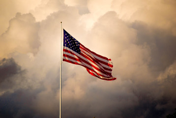 The American flag flies high as a storm approaches