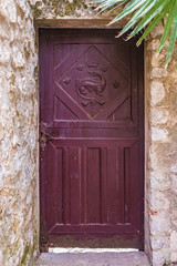 Ornate old door in the picturesque medieval city of Eze Village in the South of France along the Mediterranean Sea