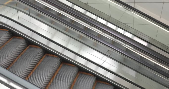 Long Escalators to Underground Metro Station