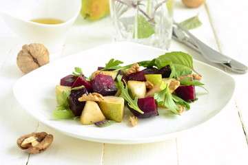 Roasted beets with pear, walnut and arugula