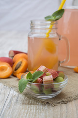 fruit juice from rhubarb on a wooden table. 