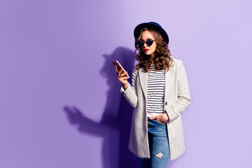 Portrait of busy cool business woman in jeans overcoat striped o