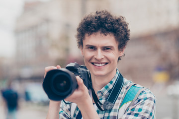 Portrait of curly haired cute attractive smiling handsome guy bl