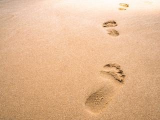 close up footprint on sand at the beach background