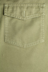 close up of a pocket on brown shirt - detail of fabric clothes.