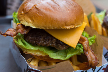 Delicious fresh burger close up. Selective focus with shallow depth of field