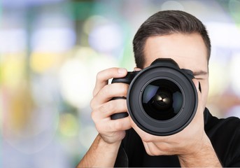 Woman-photographer takes images, isolated