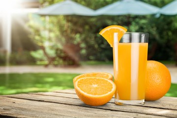 Orange Juice in glass on natural background