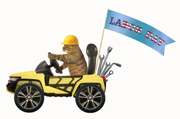 The cat in a helmet is driving a yellow suv with a banner 