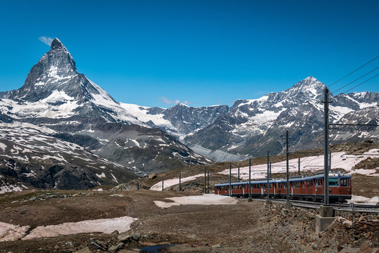 Gornergrat tourist train with Matterhorn mountain in the background. Valais region, Zermatt, Switzerland.
