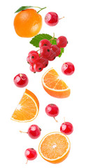 Flying orange and red currant isolated on white