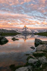 Cercles muraux Cervin Morning shot of the golden Matterhorn (Monte Cervino, Mont Cervin) pyramid and  blue Stellisee lake. Sunrise view of majestic mountain landscape in Switzerland.