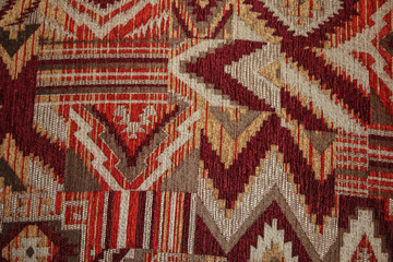 Geometric pattern on fabric texture red, burgundy and white colors