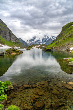 Swiss alps water reflection in Lac de Louvie - mountain lake above Val de Bagnes valley, Switzerland.