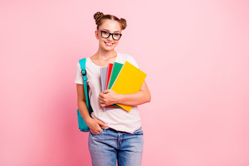 Portrait of sweet reader schoolgirl in denim jeans holding a mul - obrazy, fototapety, plakaty