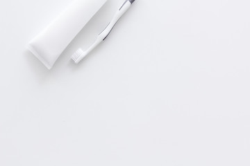 Clean teeth. Toothbrushes and tooth paste on white background top view space for text