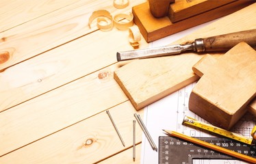 Carpentry tools with wooden planks and Blueprint.