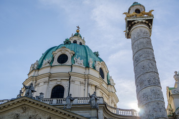 karls church in Vienna with column and sun