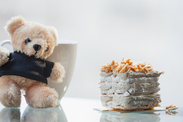 Coffee Meringue Cake on top Almond with little teddy bear